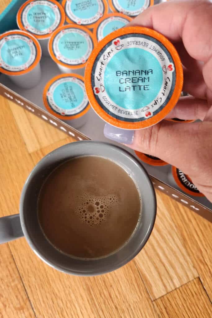 perk box by smart sips - pictured perk box k-cups and a filled cup of coffee in gray mug