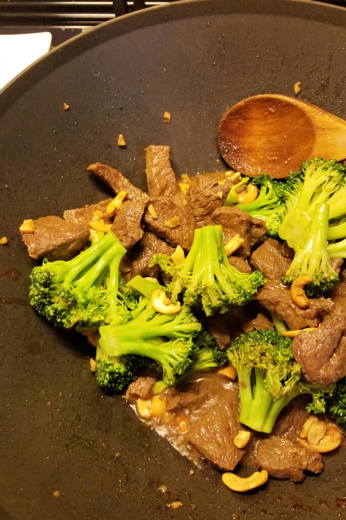 stir fry orange beef in wok