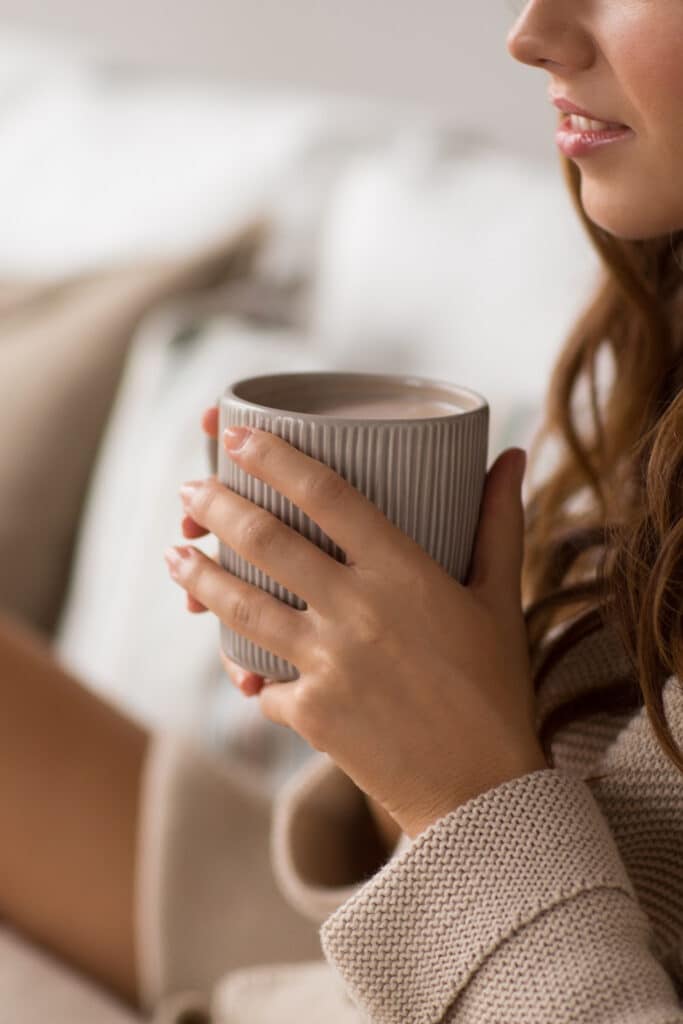 woman holding mug in hand