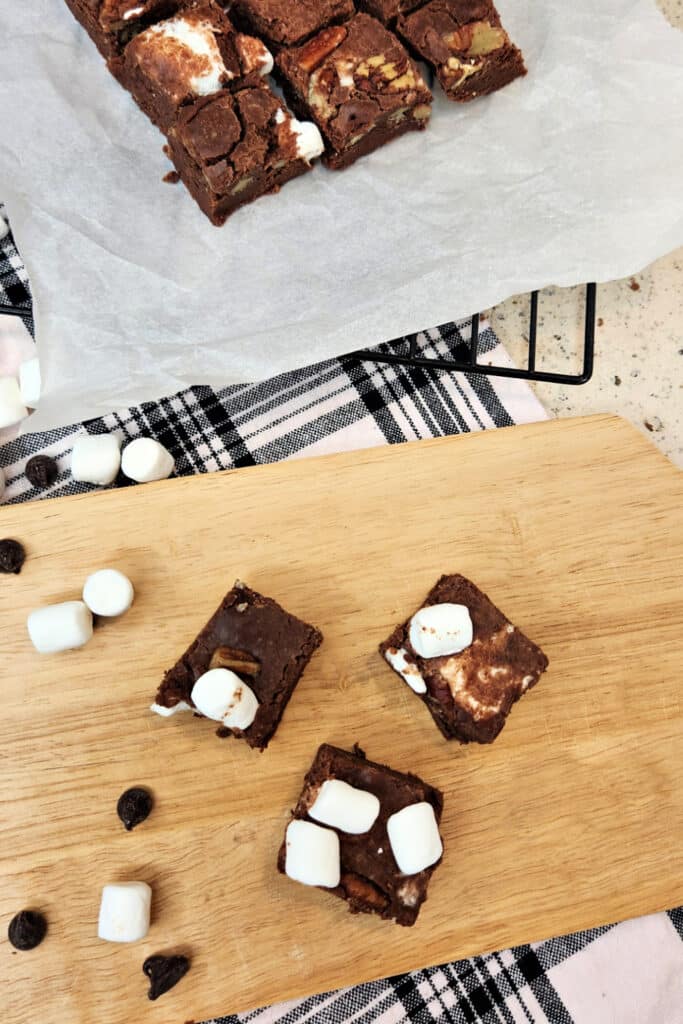 Chopped fudge on cutting board and parchment paper