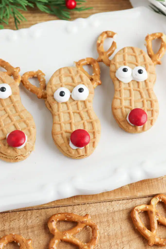 Finished Nutter Butter reindeer cookies on white plate