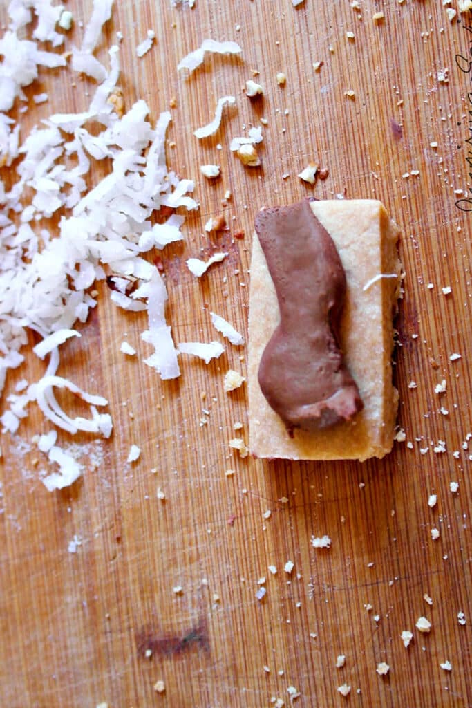 adding chocolate stip to shortbread cookie