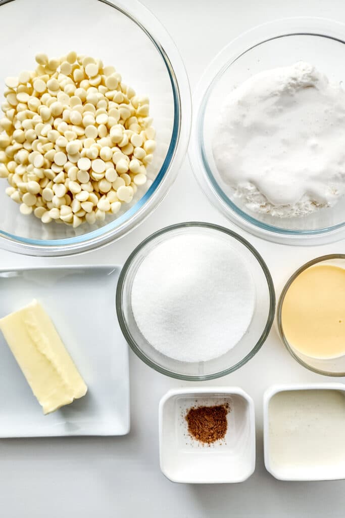 ingredients for eggnog fudge. Pictured white chocolate chips, sugar, butter
