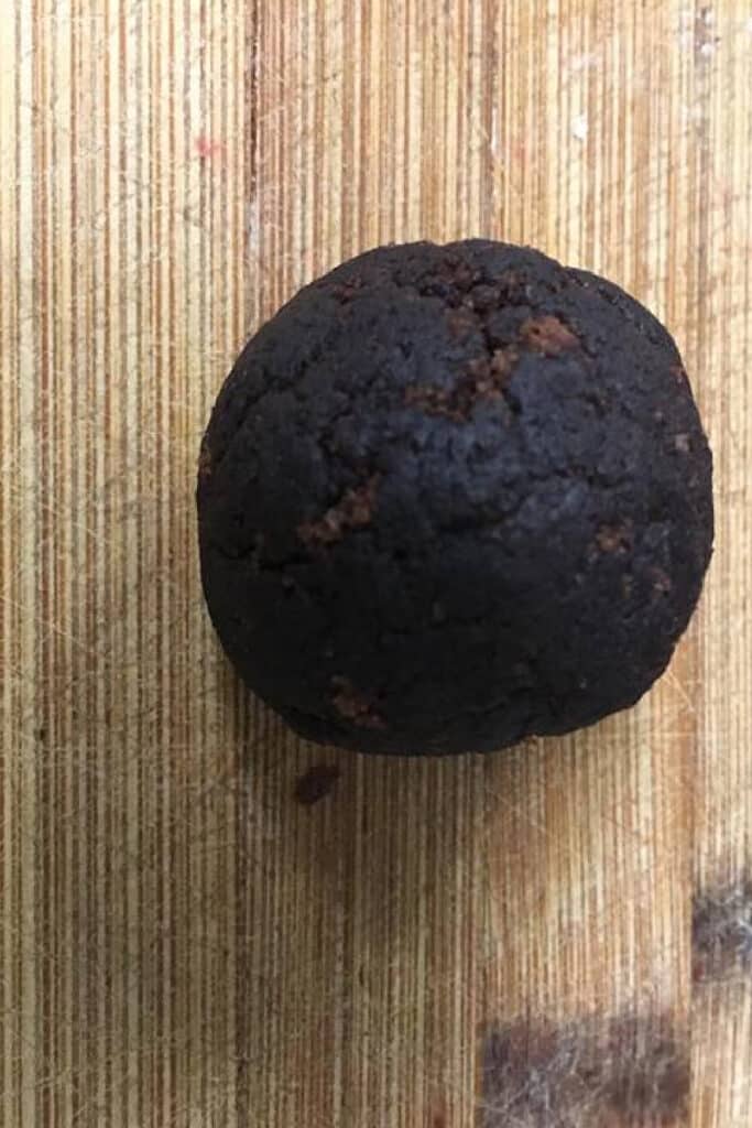 making a chocolate cake ball on wooden background