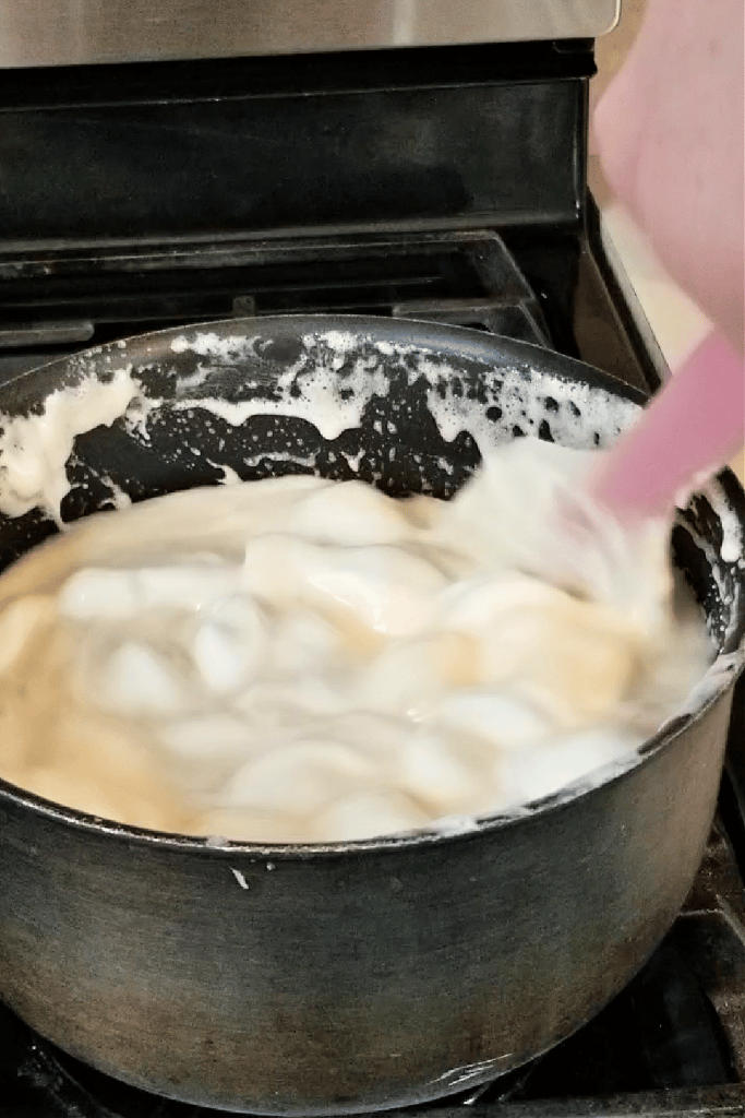 mixing melting marshmallows on stovetop