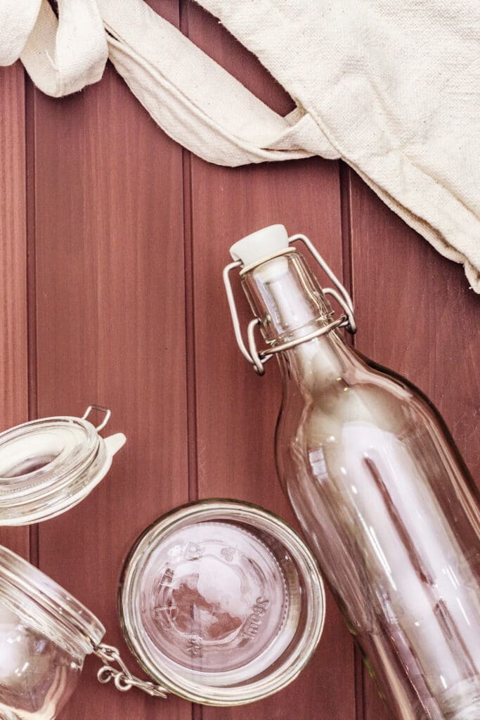 reusing glass jars - picture of mason jars on wooden background