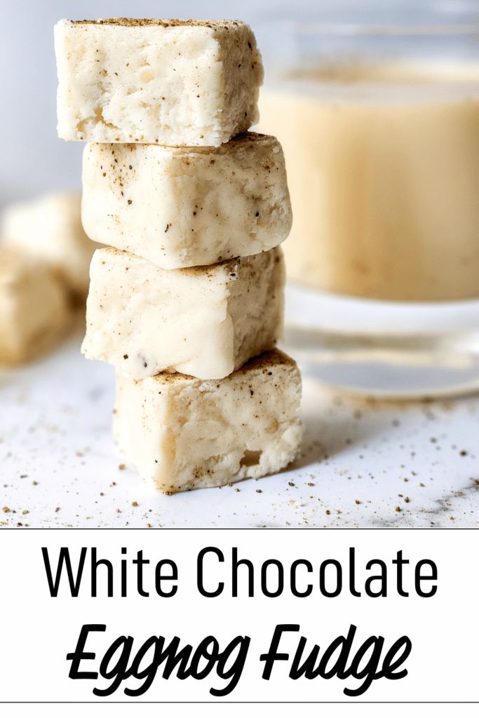 white chocolate eggnog fudge, cut into squares stacked on top of each other
