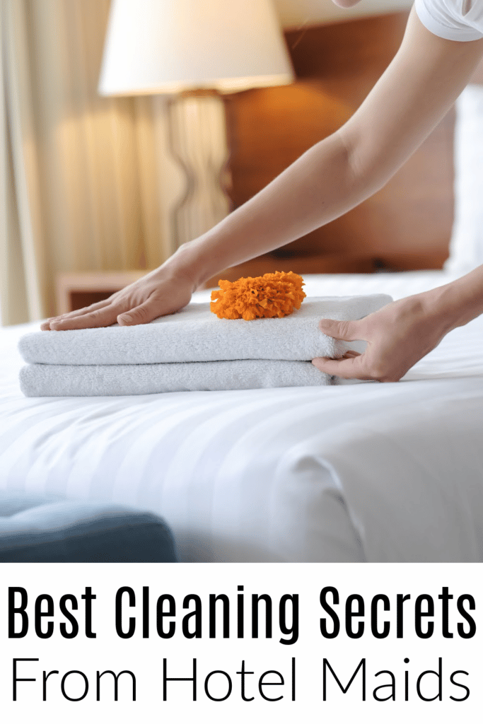 Best cleaning secrets from Hotel Maids - hotel maid folding towels on bed
