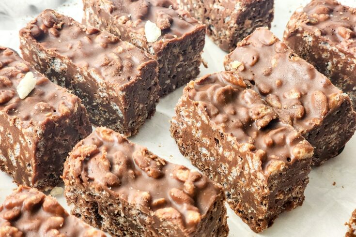 Vegan Chocolate Peanut Butter Crunch Bars on white parchment paper