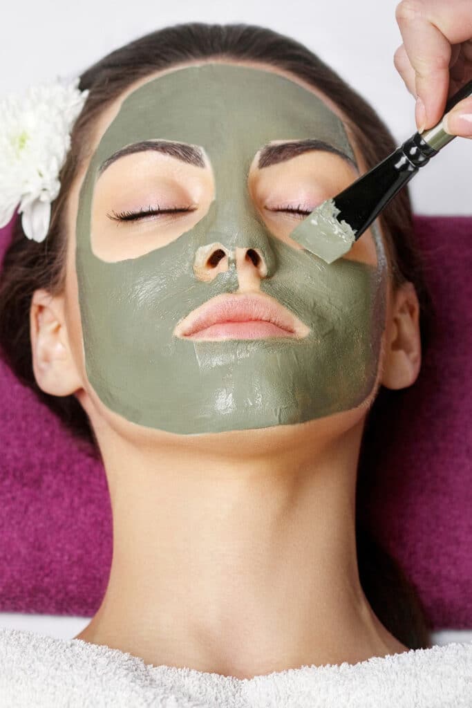 beauty treatments popular recipes - woman with green clay mask on her face