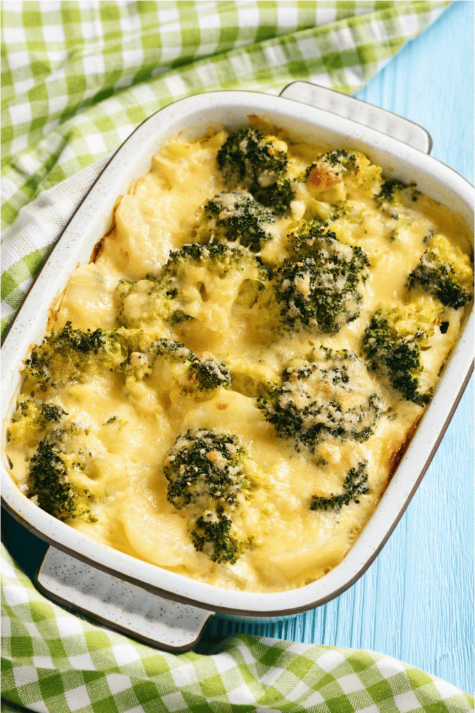 broccoli and cheese casserole on blue background, made from leftover