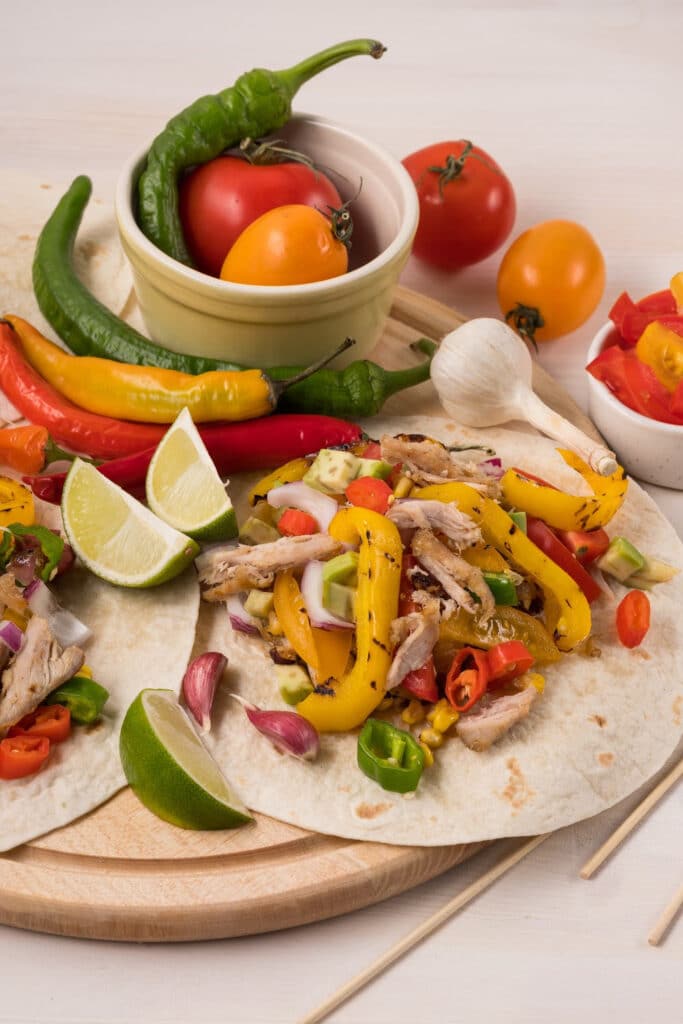 fajitas made from leftover chicken on cutting board ready to serve