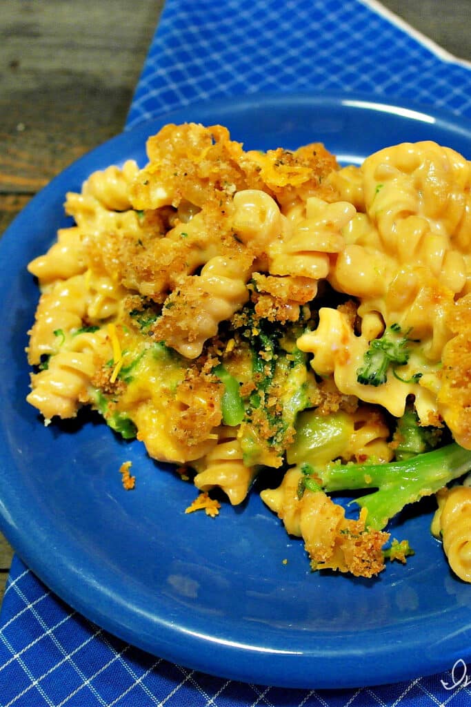 the best broccoli casserole dish on blue plate ready to be served