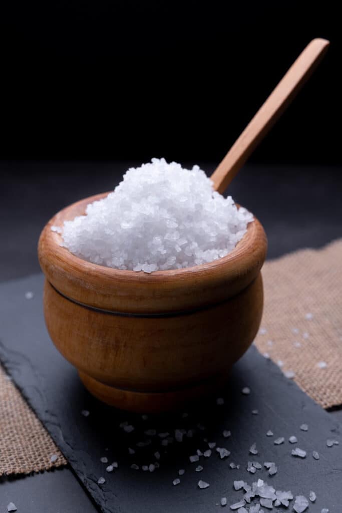 Loose salt granules in bowl - is a natural cleaning product