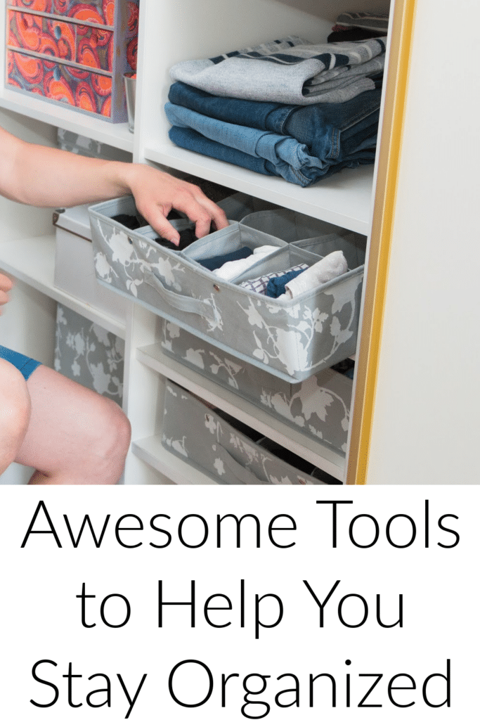 ten awesome tools to help you stay organized - pictured woman organizing her close with clear plastic bins