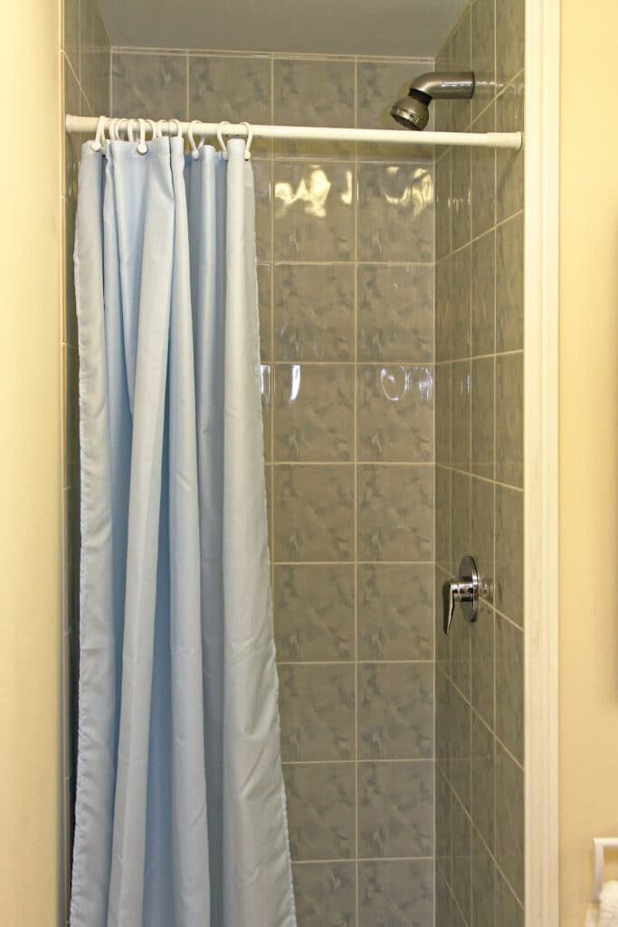 Blue shower curtain in bathroom