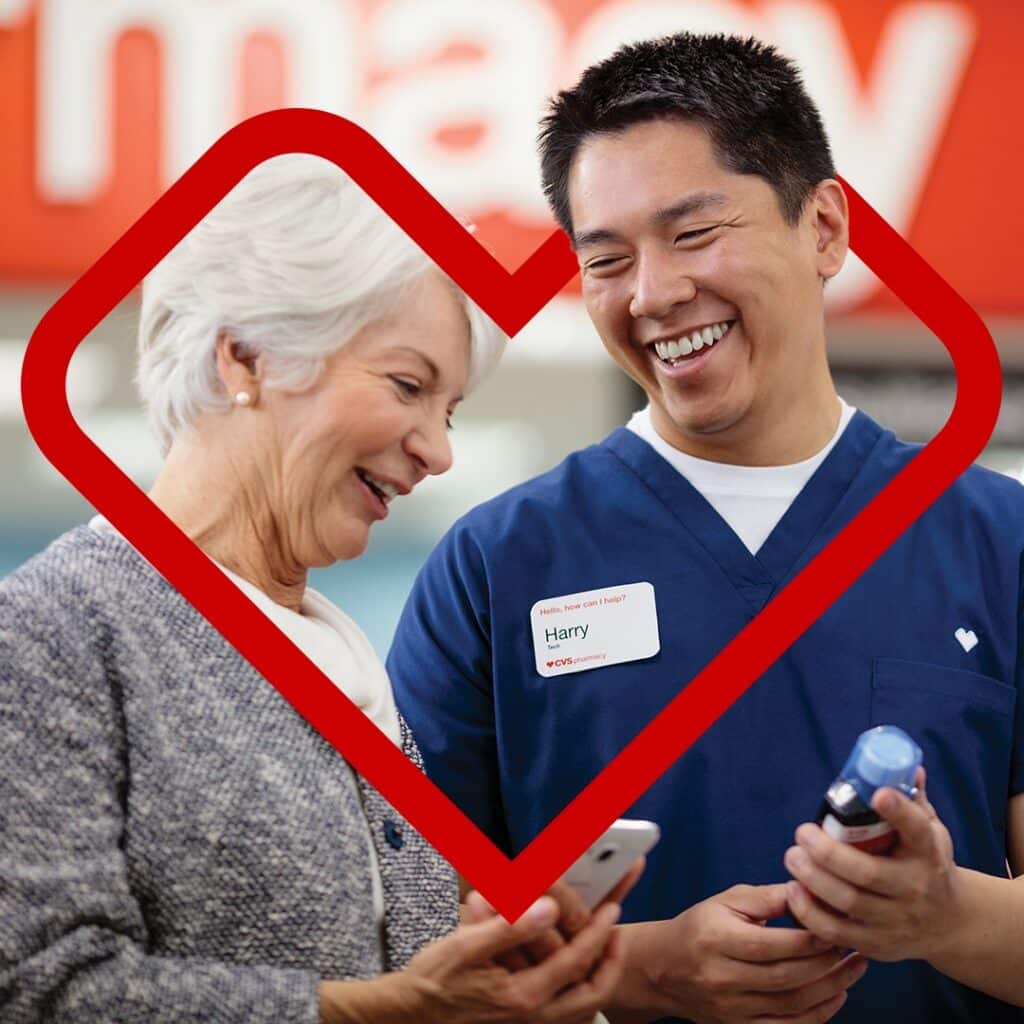 pharmacy at cvs - pharmacy tech helping an elderly woman