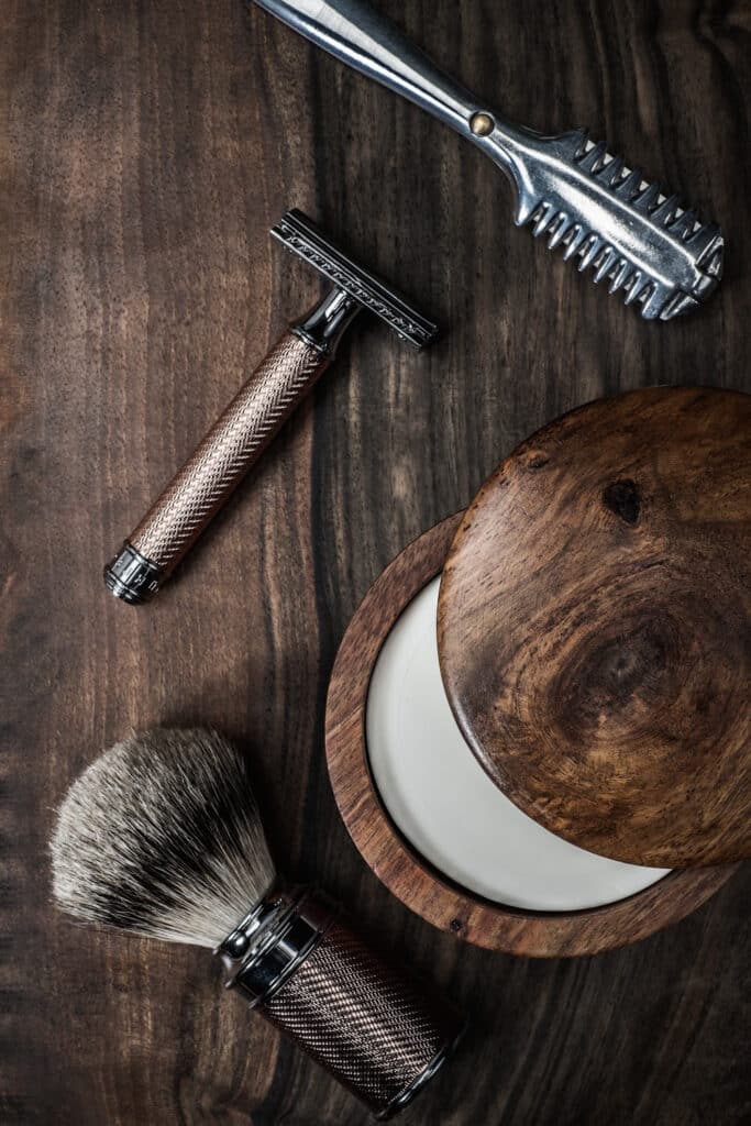razors in bathroom on wooden background