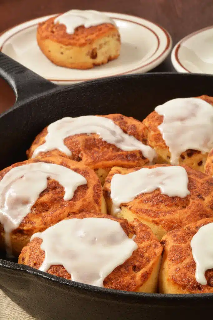 Cast Iron Skillets bake in oven - pictured homemade cinnamon tolls on skillet