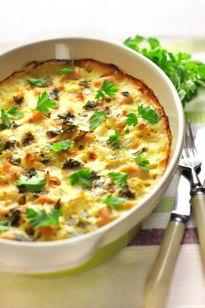 Cheesy bread casserole in white bowl - how to use leftover stale bread