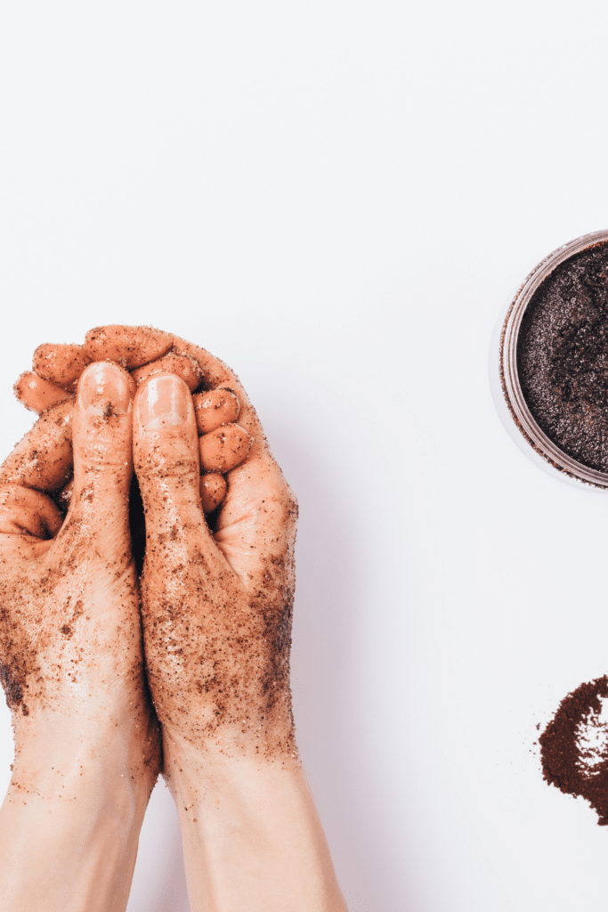 scrubbing hands with coffee grounds