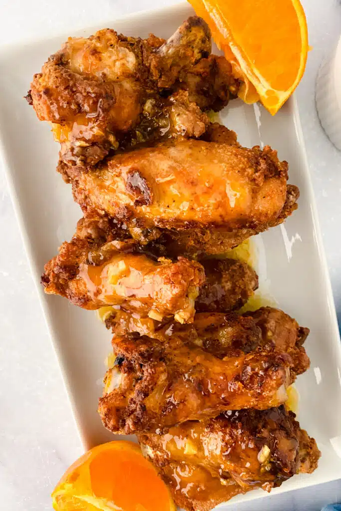 orange glazed chicken on white plate ready for serving