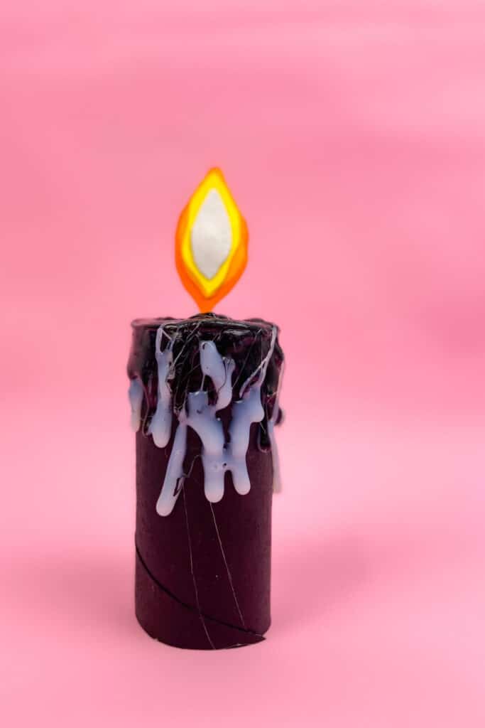 DIY Halloween Toilet Paper Roll Candle completed - pink background