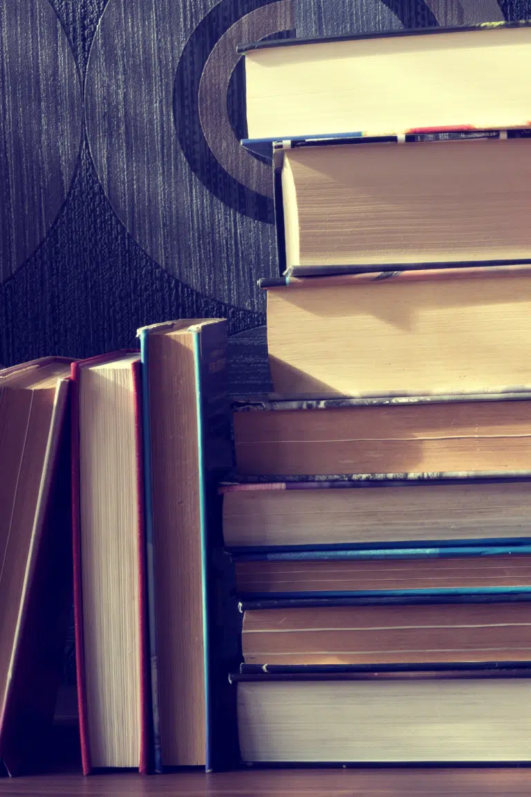 too many books - stacked books on shelf