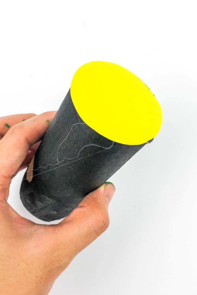 yellow paper to top of toilet paper roll