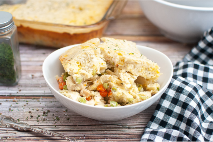 Chicken Cobbler Casserole on white bowl on dinner table