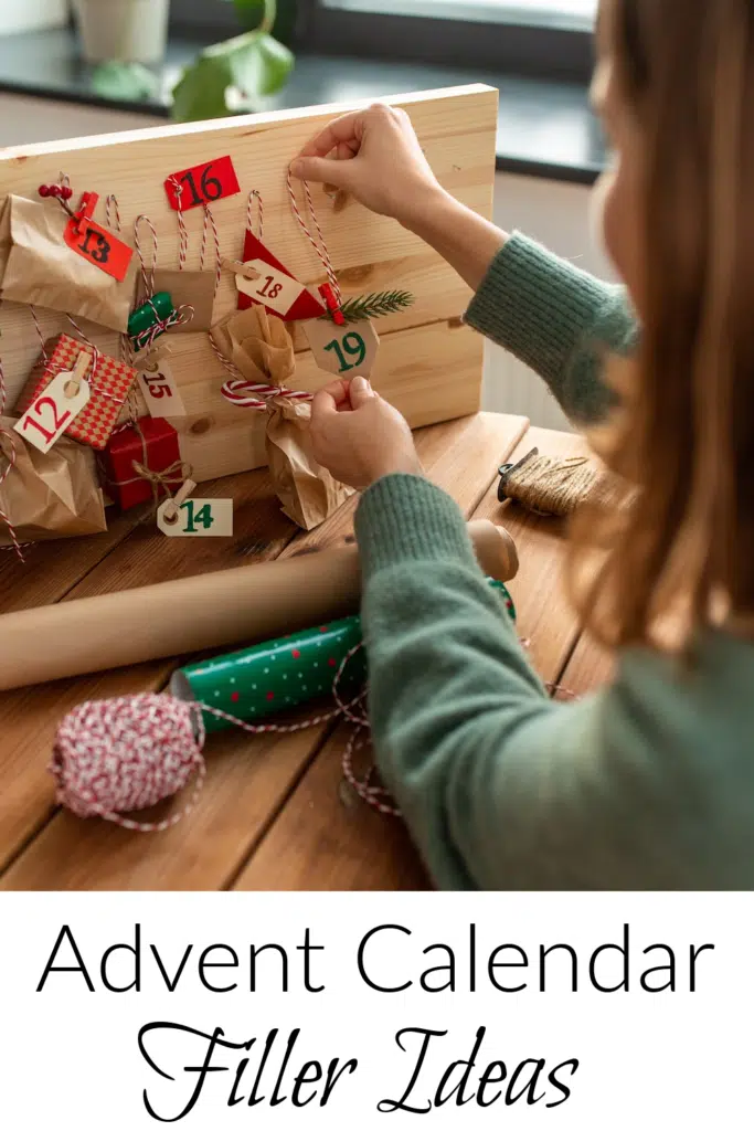 Text overlay "perfect advent calendar filler idea" Pictured little girl opening door to wooden advent calendar