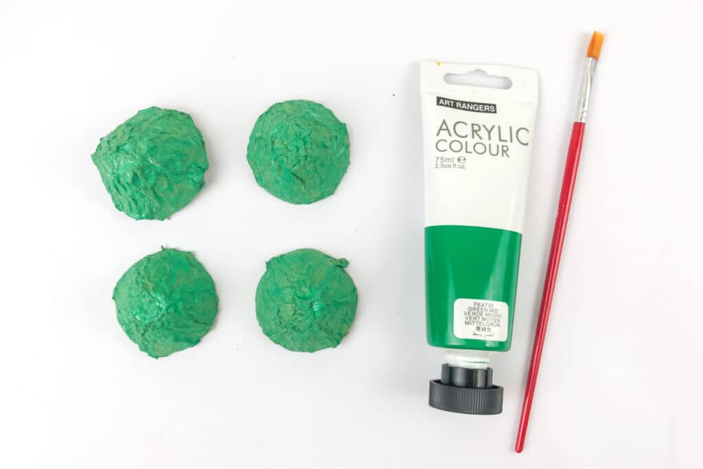 Green painted egg carton pieces for Christmas Elf