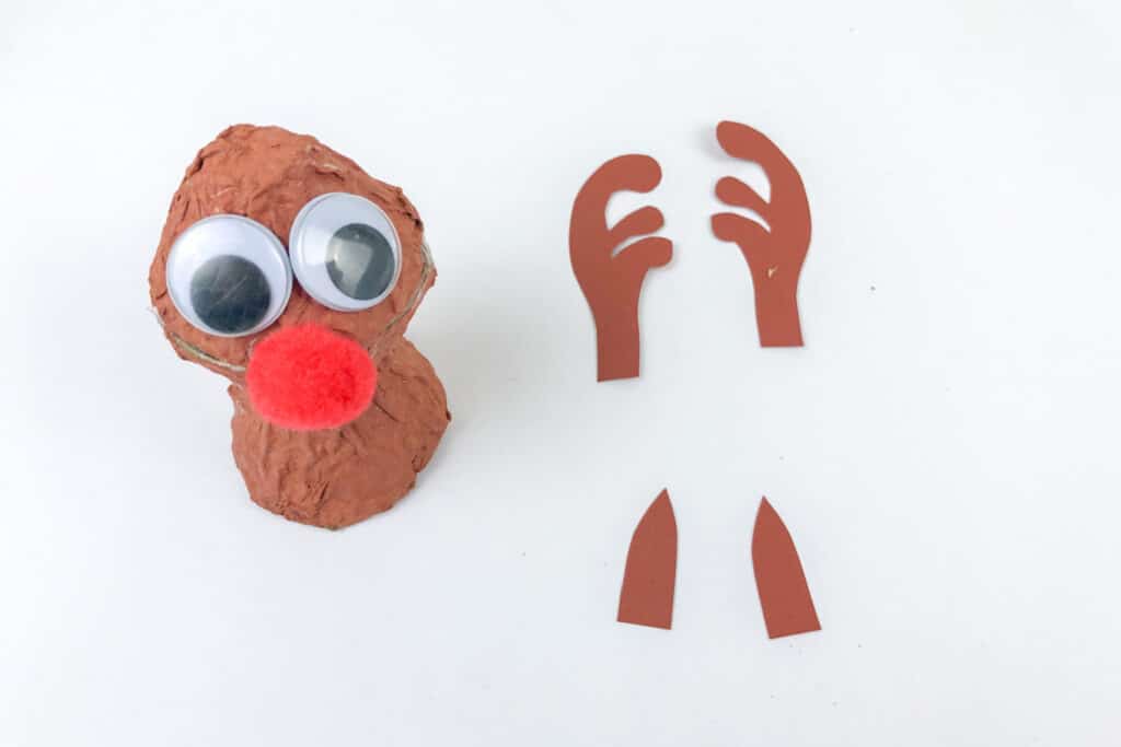 attaching eyes and nose to reindeer