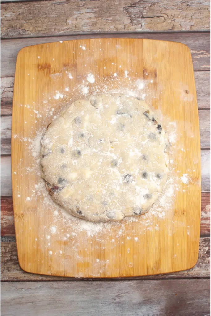 Shaping scone dough into a large circle for cutting into wedges