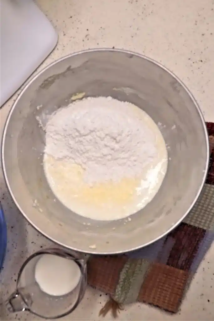 mixing flour mixture and buttermilk with butter mixture