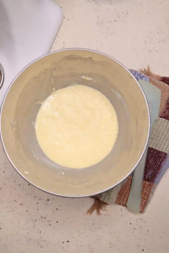 sugar butter mixture in large bowl from mixing stand