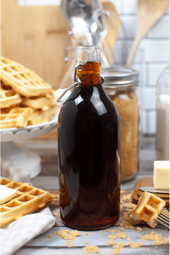 Delicious Homemade Pancake syrup made from brown syrup in tall bottle