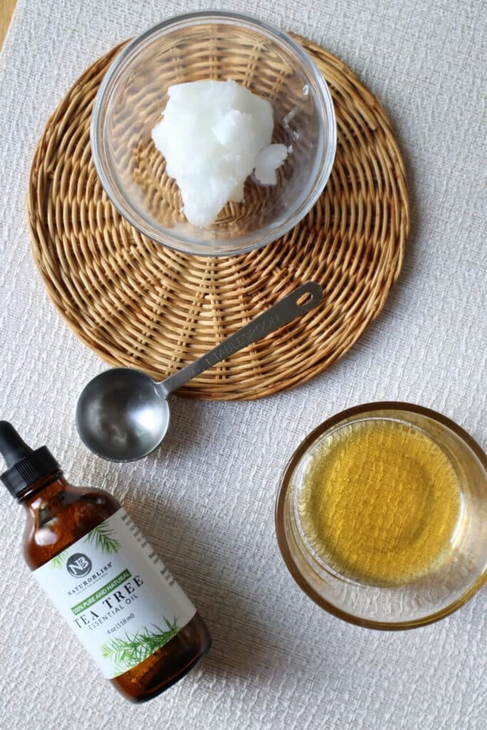 Ingredients needed for coconut face wash, includes tea tree oil, honey and coconut oil