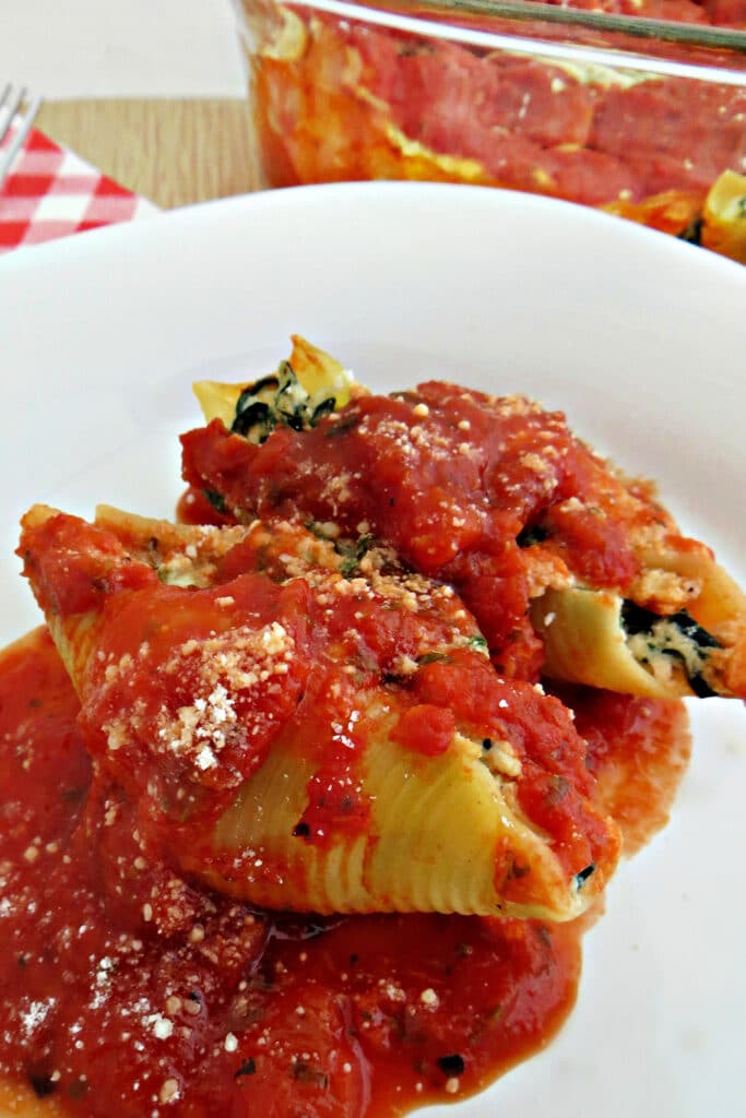 Stuffed Shells Italian on white plate Classic dish for family dinner