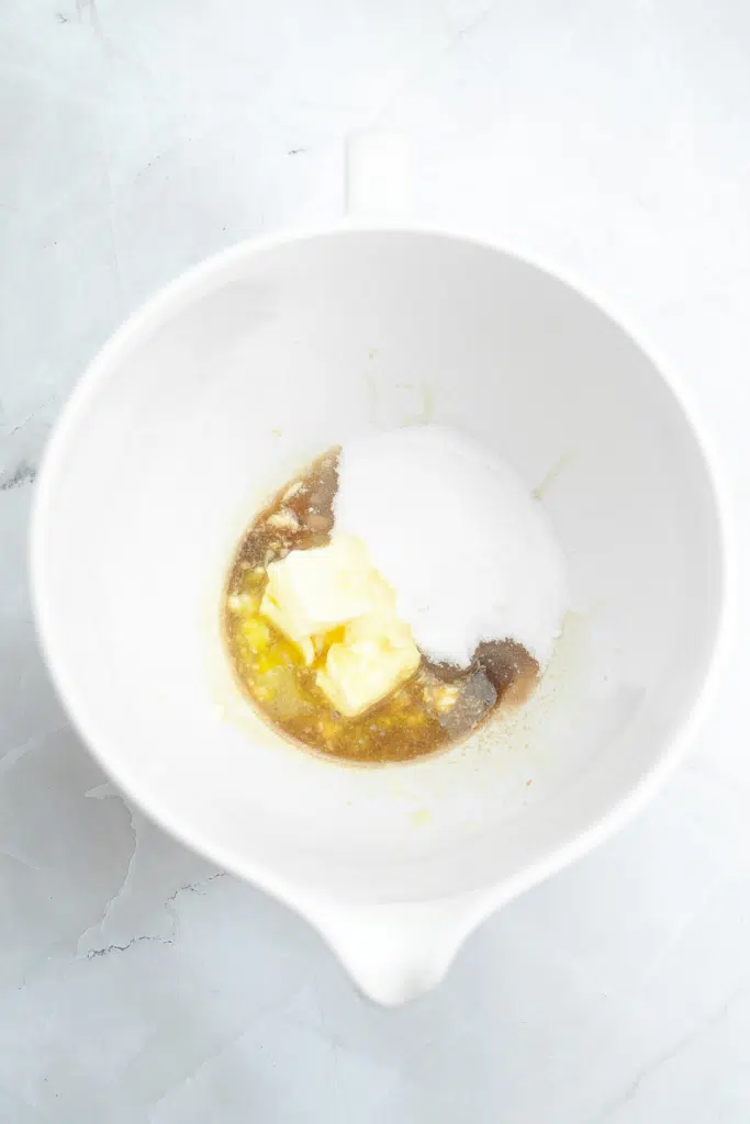 Creaming butter, sugar and vanilla together in mixing bowl