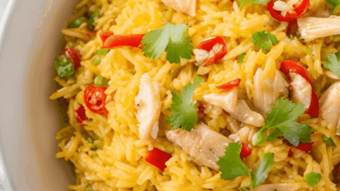 Chicken Paella with Chopped Pimentos in white bowl ready to serve