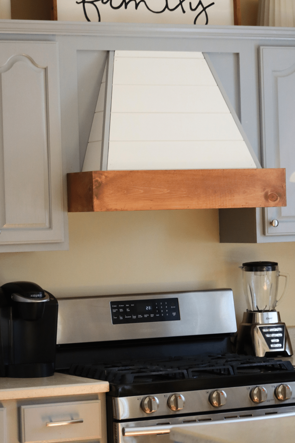 Updated hood range with wood accent and shiplap