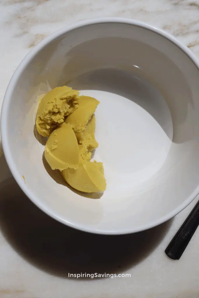 shea butter and water in white bowl