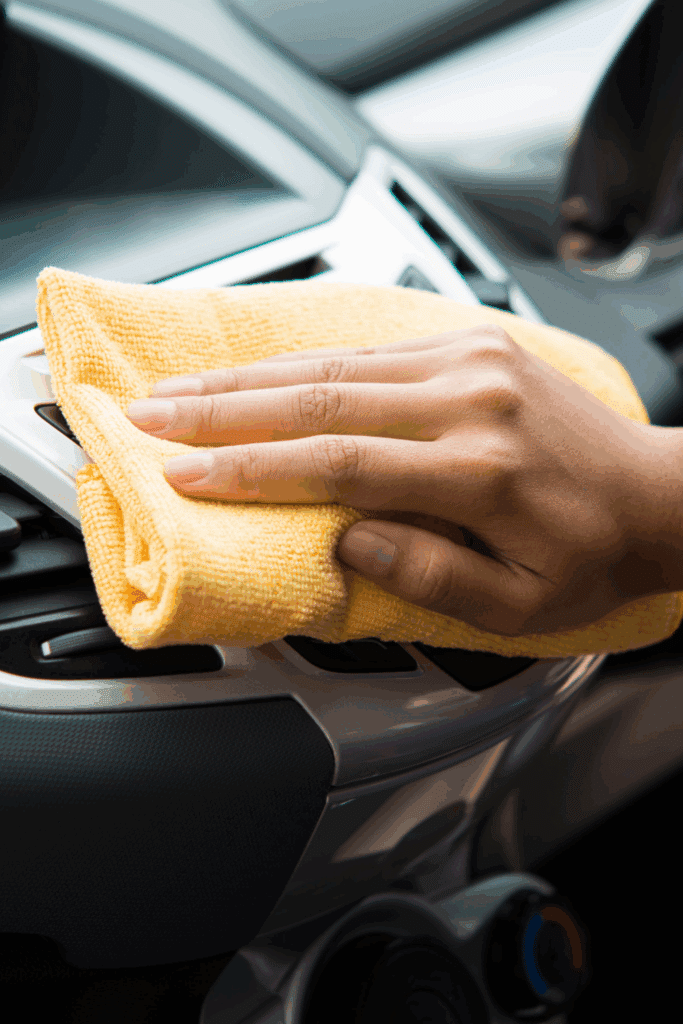 cleaning inside of car with microfiber cloth