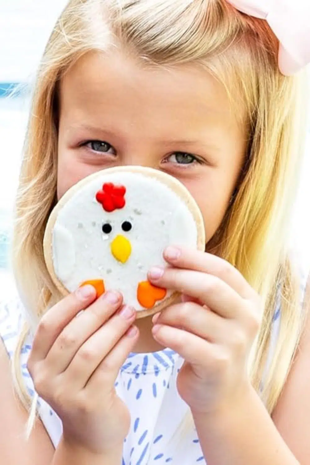 Little girl with decorated cookie