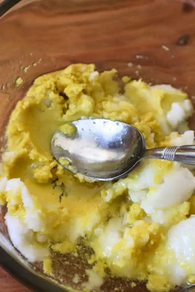 Mashing Ingredients together in bowl for sun lotion