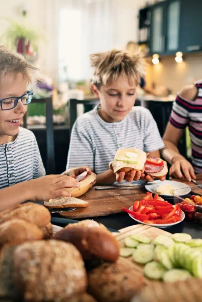 kids making sandwiches for a picnic