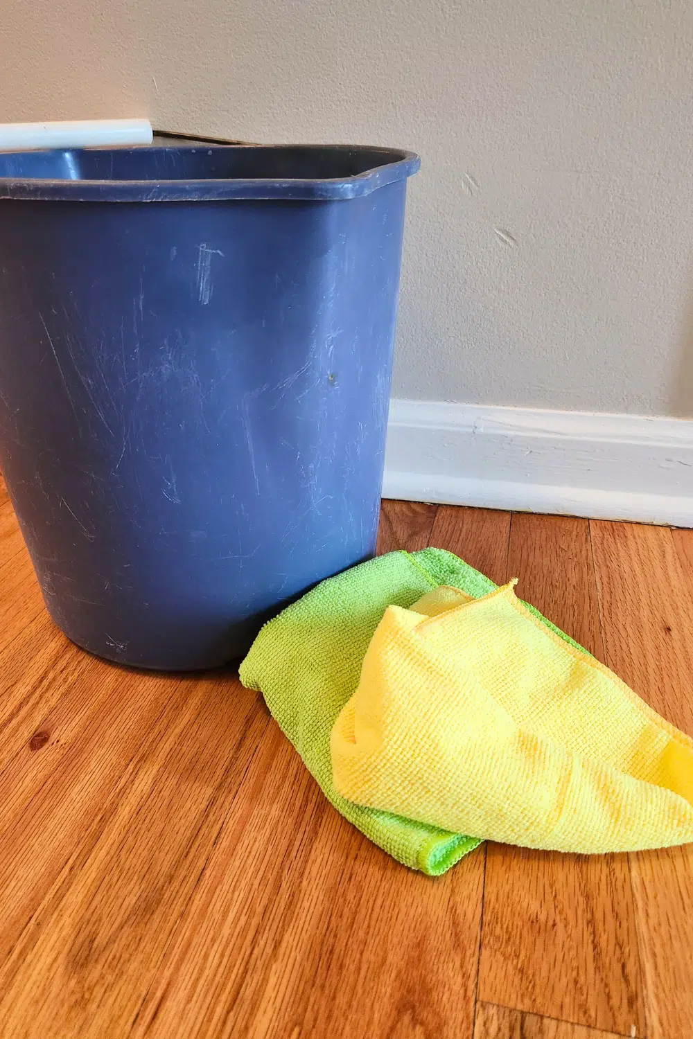 Bucket with microfiber clothes ready to clean baseboards
