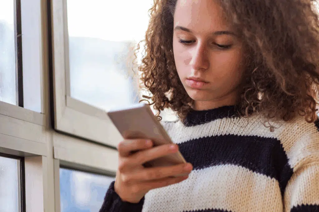 phone one hand Photo Credit Canva Pro Stock Image