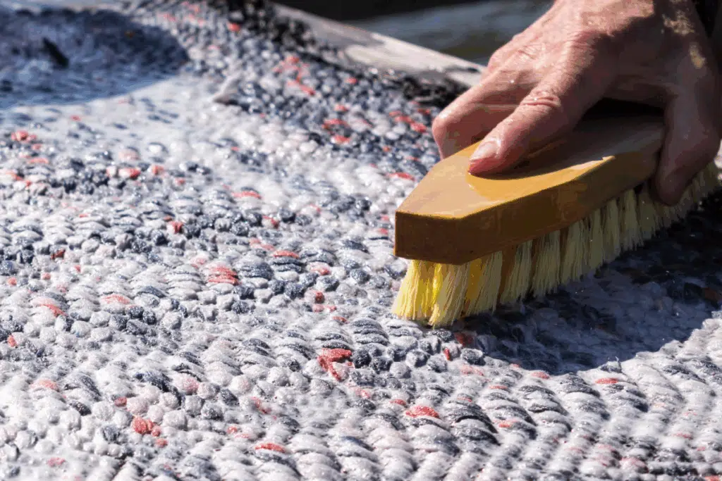scrubbing carpet Photo Credit Canva Pro Stock Image